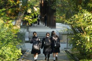 Three children walking towards a school building, the everyday school setting in the evaluation and treatment of child and adolescent ADHD